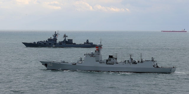 Chinese and Russian destroyers sail in formation after a joint naval exercise in the East China Sea, Dec. 27, 2022.