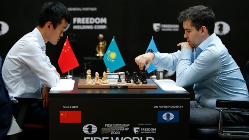 Ian Nepomniachtchi, right, plays against Ding Liren during their tiebreaker. 