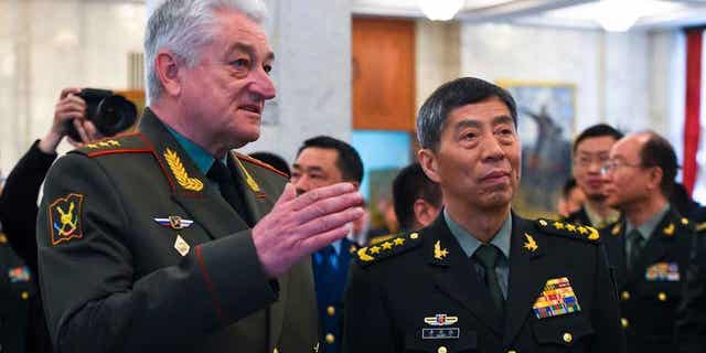 Chief of the Military Academy of the General Staff of the Armed Forces of the Russian Federation Col. Gen. Vladimir Zarudnitsky, left, escorts Chinas Defense Minister Gen. Li Shangfu during a tour in Moscow, Russia, on April 17, 2023. 