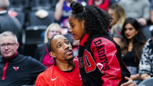 DeMar DeRozan embraces his daughter Diar before the game against the Toronto Raptors.