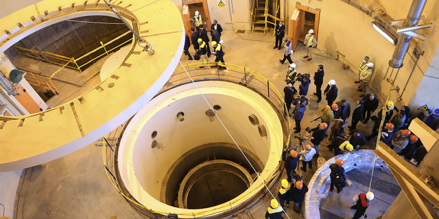 Technicians work at the heavy-water reactor near Arak, Iran, in December 2019.