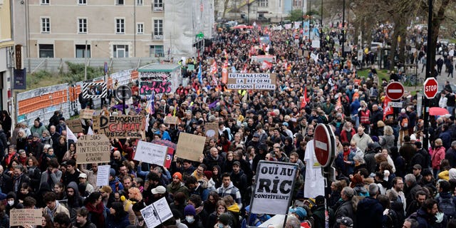 Demonstrators march in protest for the 11th day of nationwide resistance in Nantes, western France, on April 6, 2023.
