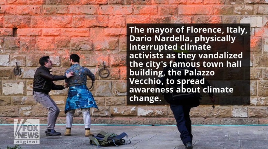 Mayor of Florence, Italy physically stops climate activists from vandalizing historic town hall building