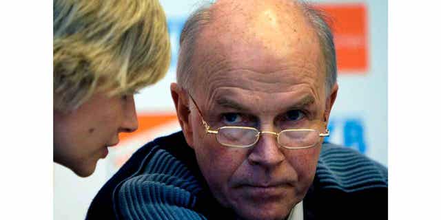 Anders Besseberg, former president of International Biathlon Union, right, listens to then IBU Secretary General Nicole Resch before a press conference in Pyeongchang, South Korea, on Feb. 13, 2009. The former president of the IBU has been indicted in his home country of Norway on bribery accusations.
