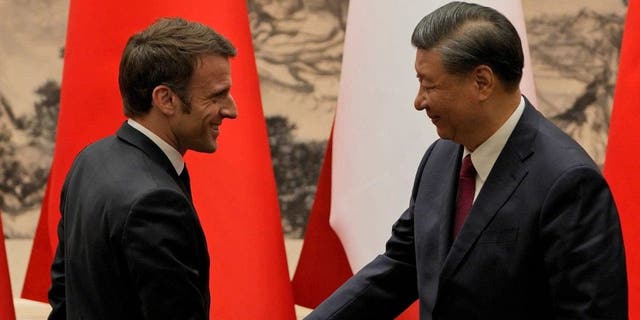 Chinas President Xi Jinping shakes hands with his French counterpart, Emmanuel Macron, in Beijing on April 6, 2023.