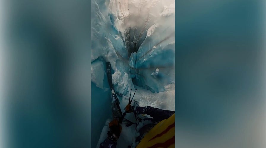 Alpine skier plunges down seemingly endless snow crater 