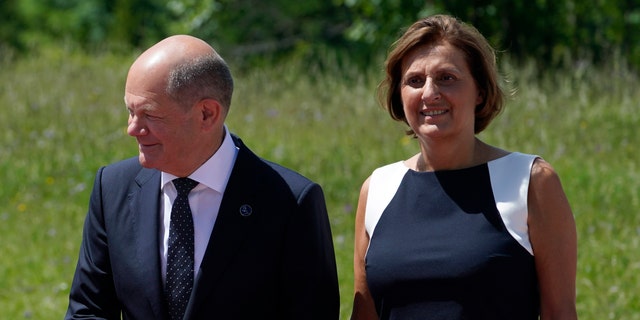 German Chancellor Olaf Scholz, left, and Britta Ernst, the former Brandenburg Minister of Education, attend the G7 Summit in Elmau, Germany, on June 26, 2022, during an arrival ceremony. Britta Ernst is stepping down as the education minister of the region where the couple lives, the government said on April 17, 2023.