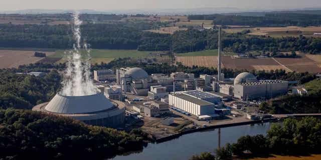 Water vapor rises from the cooling tower of a nuclear power plant in Neckarwestheim, Germany, on Aug. 22, 2022. The German government has dismissed calls on April 12, 2023, for a last-minute delay of the shutdown of the country's last three nuclear power plants. The shutdown is scheduled for April 15, 2023.