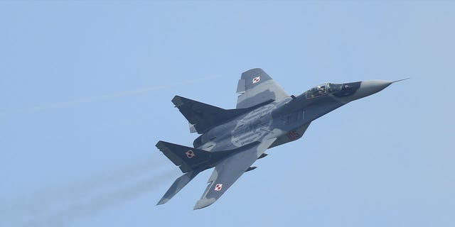 A Mikoyan MiG-29 plane of the Polish Air Force flies on June 1, 2016, in Schoenefeld, Germany. Poland plans to give five old MiG-29 planes to Ukraine to combat Russian invasion.