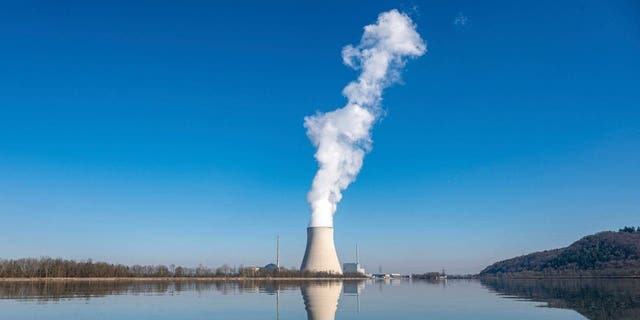FILE - Water vapor rises from the nuclear power plant Isar II in Essenbach, Germany, March 3, 2022. 