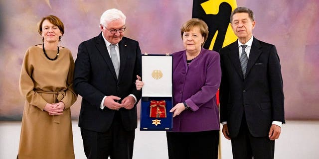 First lady Elke Buendenbender, President Frank-Walter Steinmeier, former Chancellor Angela Merkel and her husband Joachim Sauer at the award ceremony  in Berlin on April 17, 2023.