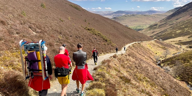 An 11-member team of rescuers was deployed to meet with the hikers after two members of the group fell ill from ingesting magic mushrooms, officials said.