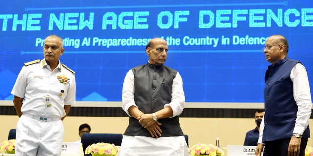 NEW DELHI, INDIA - JULY 11: Union Defence Minister Rajnath Singh with Defence secretary Ajay Kumar and Navy chief Admiral R Hari Kumar at the inauguration of Artificial Intelligence in Defence (AIDef) exhibition, in Vigyan Bhawan, New Delhi, India, on Monday, July 11, 2022. 