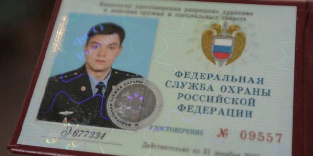 This photo provided by the Dossier Center shows the Russian Federal Protective Service identification card of Gleb Karakulov, in October 2022 in Turkey.
