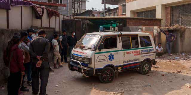 An ambulance carrying the dead body of Noel Richmond, a 56-year-old Irish climber, brought from Annapurna mountain region is seen in Kathmandu, Nepal, on April 18, 2023.