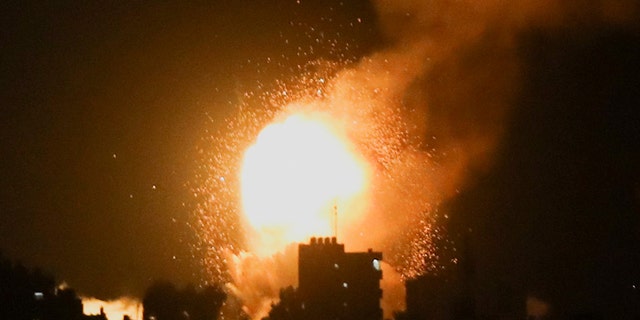 Smoke and flames rise during Israeli airstrikes in Khan Younis in the southern Gaza Strip, April 7, 2023.  