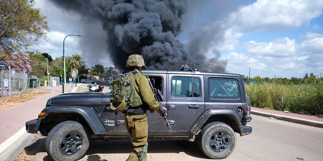 Smoke rises from a fire after rockets fired from Lebanon struck Bezet, northern Israel, Thursday, April 6, 2023. 