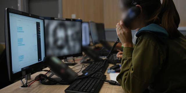 An IDF officer analyzes visual information generated with the help of artificial intelligence.