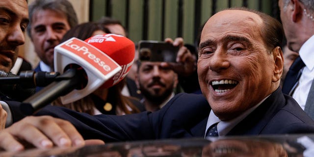 Silvio Berlusconi is mobbed by press as he leaves a reunion to decide the group leaders of at the Lower Chamber, in Rome.