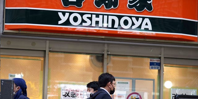 A signboard of a Yoshinoya restaurant, a fast-food beef bowl chain, is seen April 5, 2023, in Tokyo. Japanese police arrested two male suspects in a series of food pranks known as "sushi terrorism."