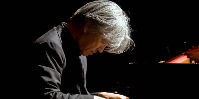 FILE - Maestro Ryuichi Sakamoto performs at Rome's Auditorium, Wednesday, Oct. 28, 2009.  Japan's recording company Avex says Sakamoto, a musician who scored for Hollywood movies such as "The Last Emperor" and "The Revenant," has died. He was 71. He died March 28, according to the statement released Sunday, April 2, 2023.
