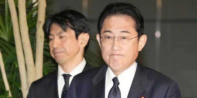 Japans Prime Minister Fumio Kishida, right, meets reporters after an army helicopter went missing, at his official residence in Tokyo on April 6, 2023. 