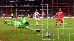 MUNICH, GERMANY - MARCH 08: Eric Maxim Choupo-Moting of FC Bayern Munich scores the team's first goal past Gianluigi Donnarumma of Paris Saint-Germain during the UEFA Champions League round of 16 leg two match between FC Bayern München and Paris Saint-Germain at Allianz Arena on March 08, 2023 in Munich, Germany. 