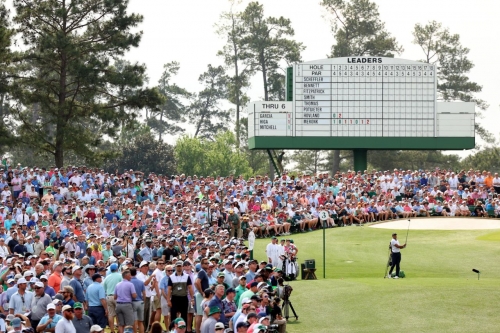 Tiger Woods plays his tee shot on the third hole Thursday.