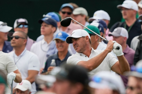Brooks Koepka watches his tee shot on the eighth hole Friday at the Masters. Koepka, who shared the first-round lead, got off to a strong start on Friday.