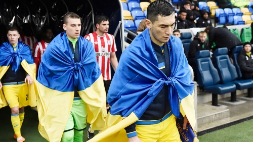 Midfielder Taras Stepanenko leads Ukraine out against Brentford B on March 23.