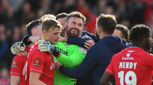 Ben Foster celebrates with his teammates after his dramatic save. 