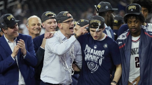 UConn head coach Dan Hurley (left) celebrates with his son Andrew after defeating the San Diego State Aztecs in the NCAA men's national championship game.