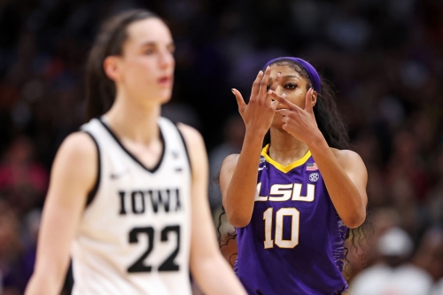 LSU's Angel Reese gestures toward her ring finger in the final moments of the game.