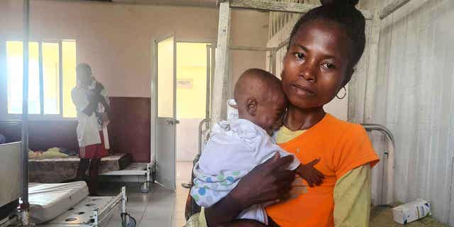 Mother Iavosoa and her 10-month-old daughter Soaravo, who is suffering with acute malnutrition, are shown at a hospital in Mananjary, Madagascar, on March 8, 2023.