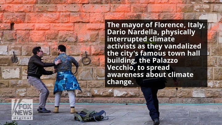Mayor of Florence, Italy physically stops climate activists from vandalizing historic town hall building