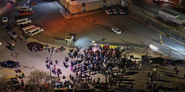 People take part in a vigil for the victims of a fire at an immigration detention center that killed dozens in Ciudad Juarez, Mexico, on March 28, 2023.