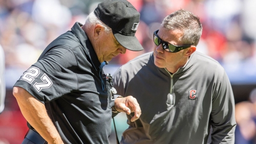 Cleveland Guardians trainer James Quinlan, right, looks after Umpire Larry Vanover after Vanover was hit with a baseball during a game between the Guardians and the New York Yankees at Progressive Field in Cleveland.