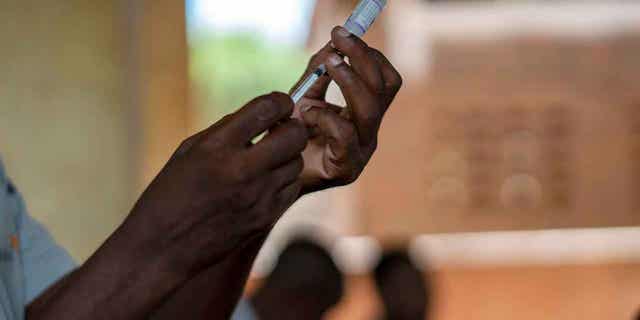 Health officials prepare to administer one of the world's first vaccines against malaria in a pilot program in Tomali, on Dec. 11, 2019. The University of Oxford said on April 13, 2023, that Ghana is the first country to approve the new Malaria vaccine for children.