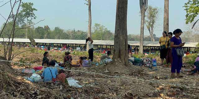 Residents from eastern Myanmar are seen after fleeing into Thailand's Tak Province on April 6, 2023. More than 5,000 people have fled from Myanmar into Thailand in recent days.