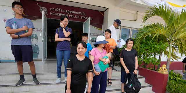Members of the Shenzhen Holy Reformed Church leave from the Nongprue police station on their way to Pattaya Provincial Court in Pattaya, Thailand, on March 31, 2023. 