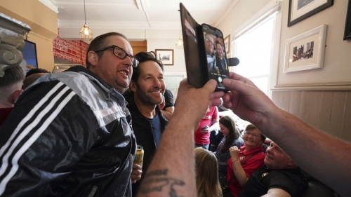 Rudd appears in photographs alongside Wrexham fans in The Turf Pub ahead of Saturday's match.