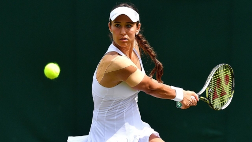 Vitalia Diatchenko plays a backhand in her ladies singles first-round match against Kristina Mladenovic at Wimbledon in 2019. 