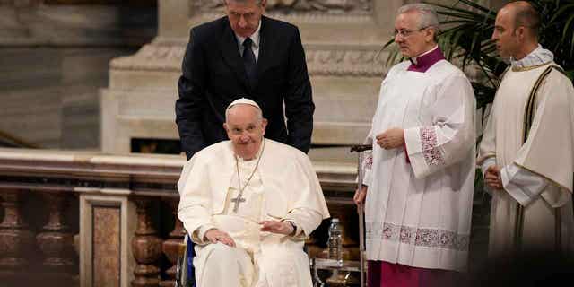 Pope Francis leaves St. Peters Basilica after celebrating the Chrism Mass at the Vatican, on April 6, 2023. Pope Francis will not preside over Good Friday's late-night Way of the Cross event in Rome due to freezing weather.