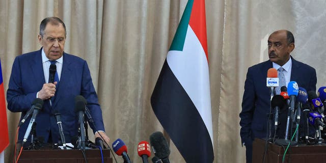 Russian Foreign Minister Sergei Lavrov, left, and Sudanese acting foreign minister Ali al-Sadiq give a joint press conference at the airport in Khartoum on Feb. 9, 2023 during an official visit to Sudan.