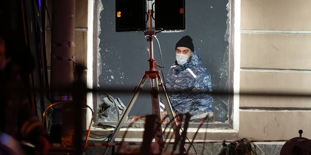 A Russian investigator works at the site of the explosion in St. Petersburg, Russia, on Sunday, April 2, 2023.