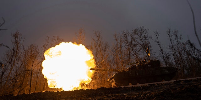 A Ukrainian tank towards fires towards Russian positions at the frontline near Bakhmut, Ukraine, Wednesday, March 8, 2023. 