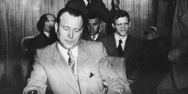 Russian diplomat Jacob Malik, chairman of the Security Council, brings a U.N. meeting to order in August 1950.