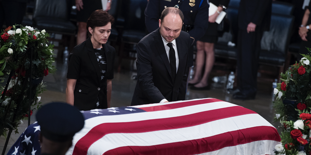 Vladimir Kara-Murza and his wife Yevgenia, pay respects to the late Sen. John McCain, R-Ariz., as the senator lies in state in the Capitol rotunda on August 31, 2018. 