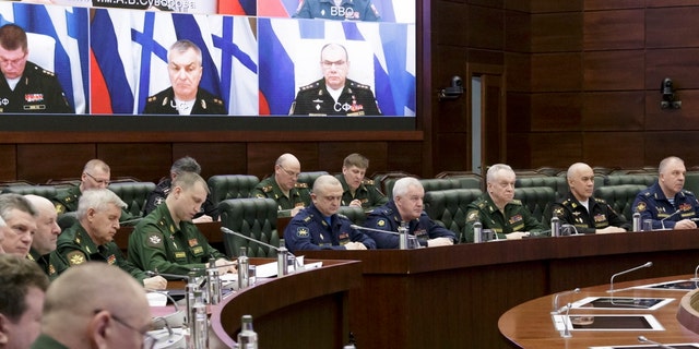In this handout photo released by Russian Defense Ministry Press Service, Russian high level officers listen to Defense Minister Sergei Shoigu during a meeting in Moscow, Russia, Friday, April 14, 2023.
