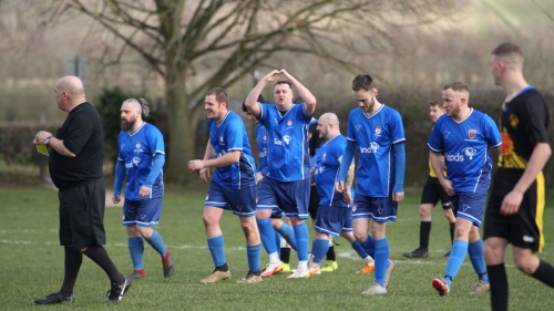 Players from Sands United FC South Yorkshire celebrate a goal.